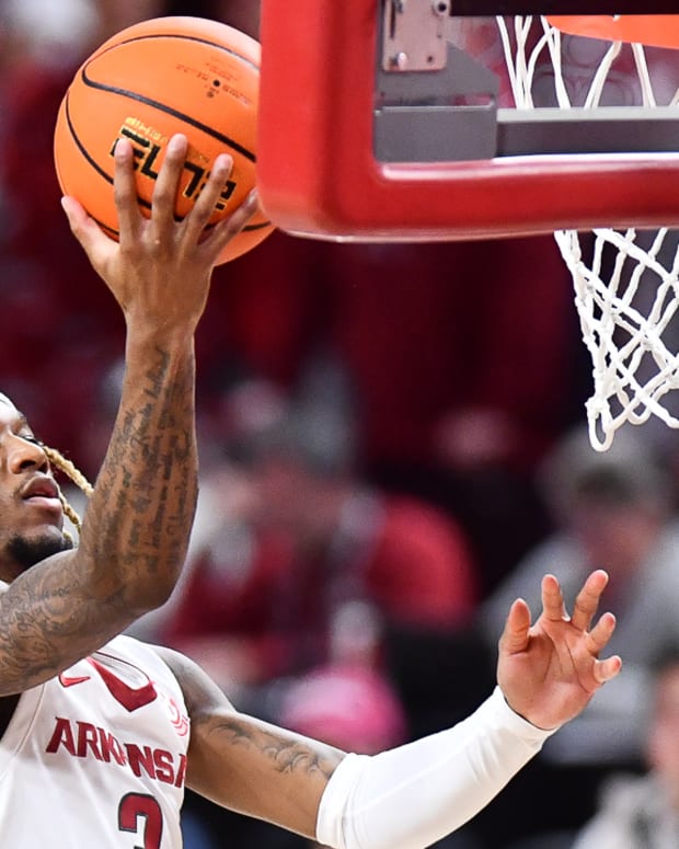 Razorbacks guard El Ellis with a layup against Texas A&M